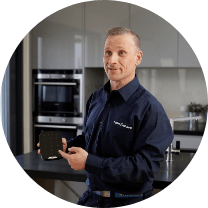 home-alarm-installer-holding-keypad